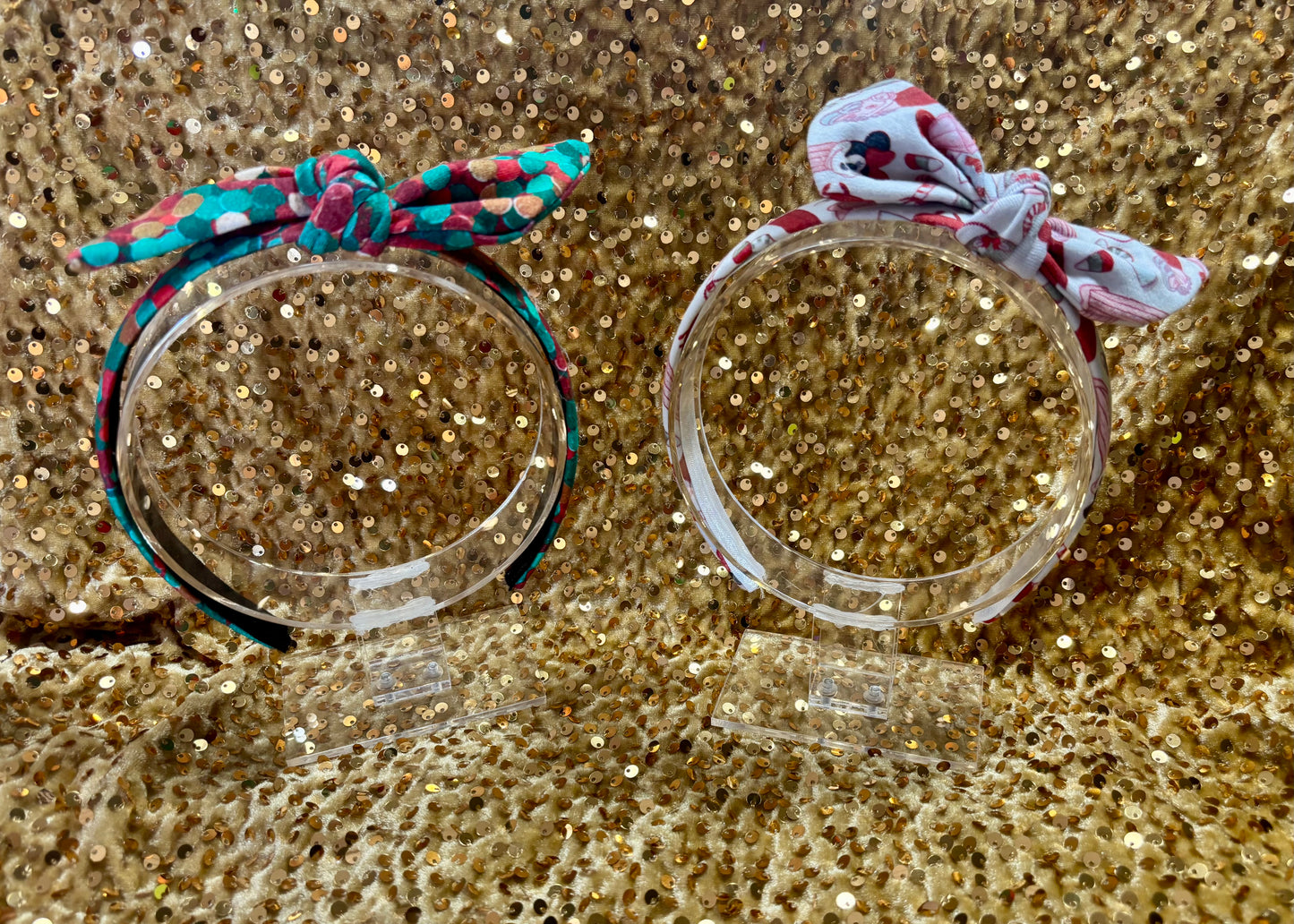 Two Handmade and ready to ship twisted bow headbands with designs in Christmas dots and Stocking Stuffers. Fabric is a soft and stretchy cotton Lycra fabric on universal sized headbands. 