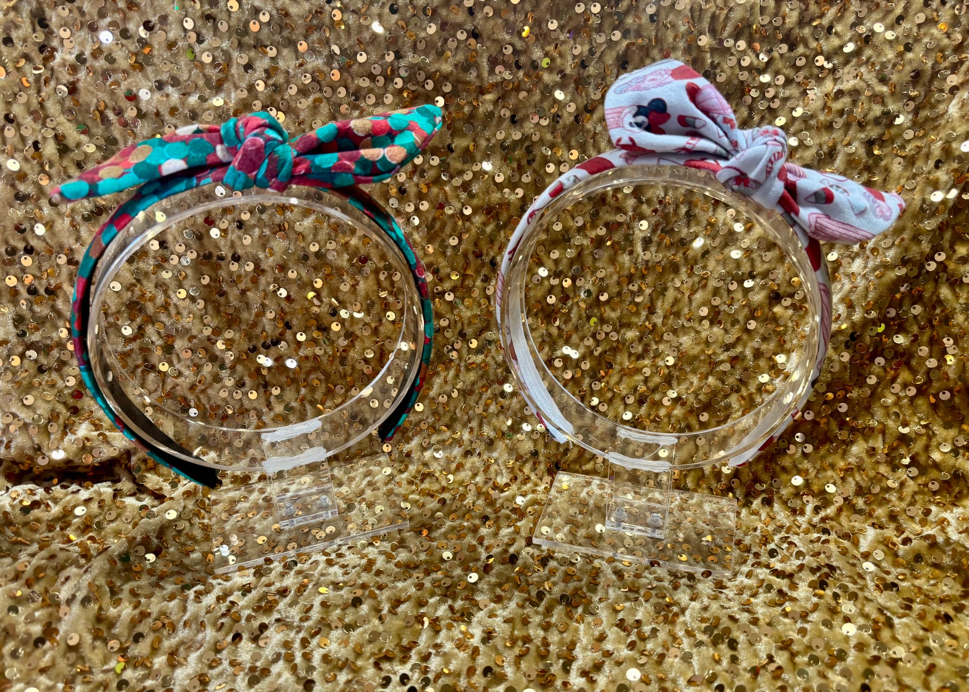 Two Handmade and ready to ship twisted bow headbands with designs in Christmas dots and Stocking Stuffers. Fabric is a soft and stretchy cotton Lycra fabric on universal sized headbands. 