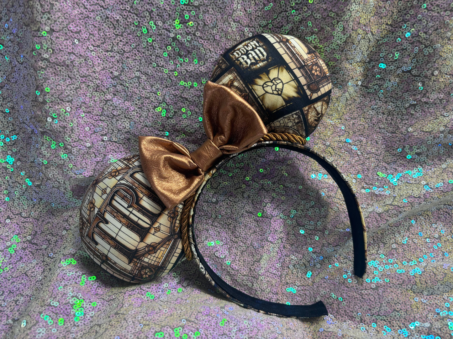 Mouse ears with decorative design on a textured background