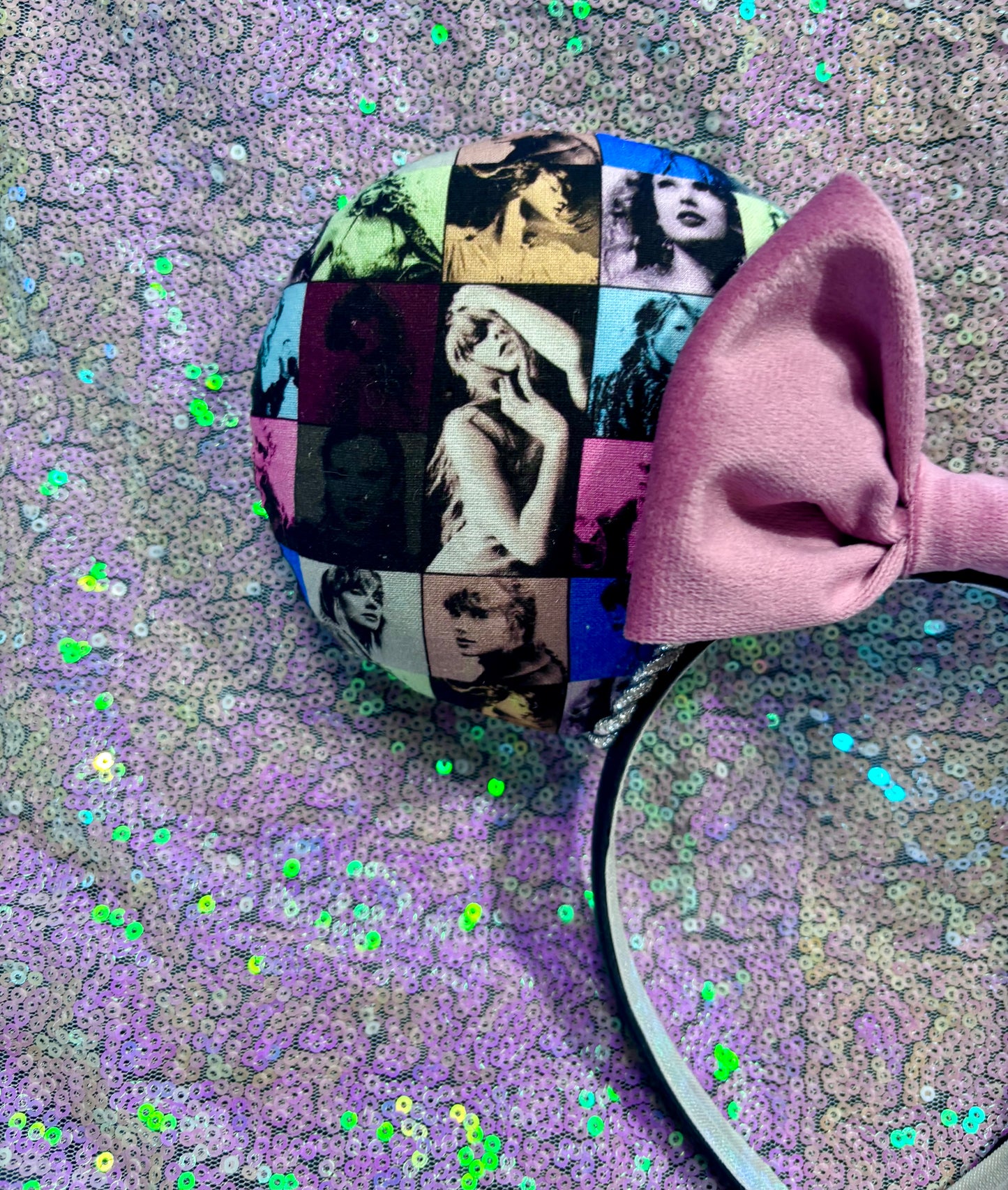 Front ear close up of the images of Tay on the ear along with the twisted trim and velvet bow.