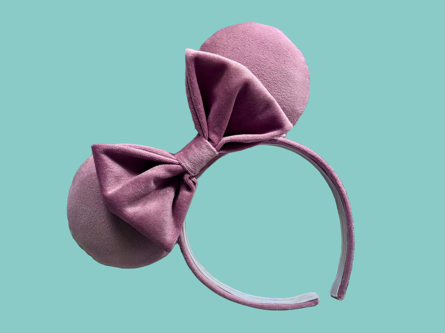 Handmade and ready to ship. Soft Velvety dusty pink Mouse ears with a soft matching bow with pink twisted trim on a universal sized matching headband. 