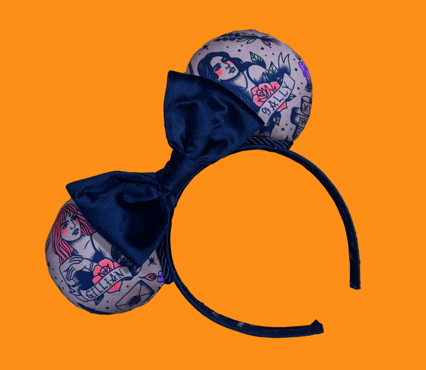 Handmade and ready to ship Practically Magical Mouse ears with the fabric on the ears, front and back and a black velvet bow. The headband is a universal sized headband and has black poly cotton fabric on it.