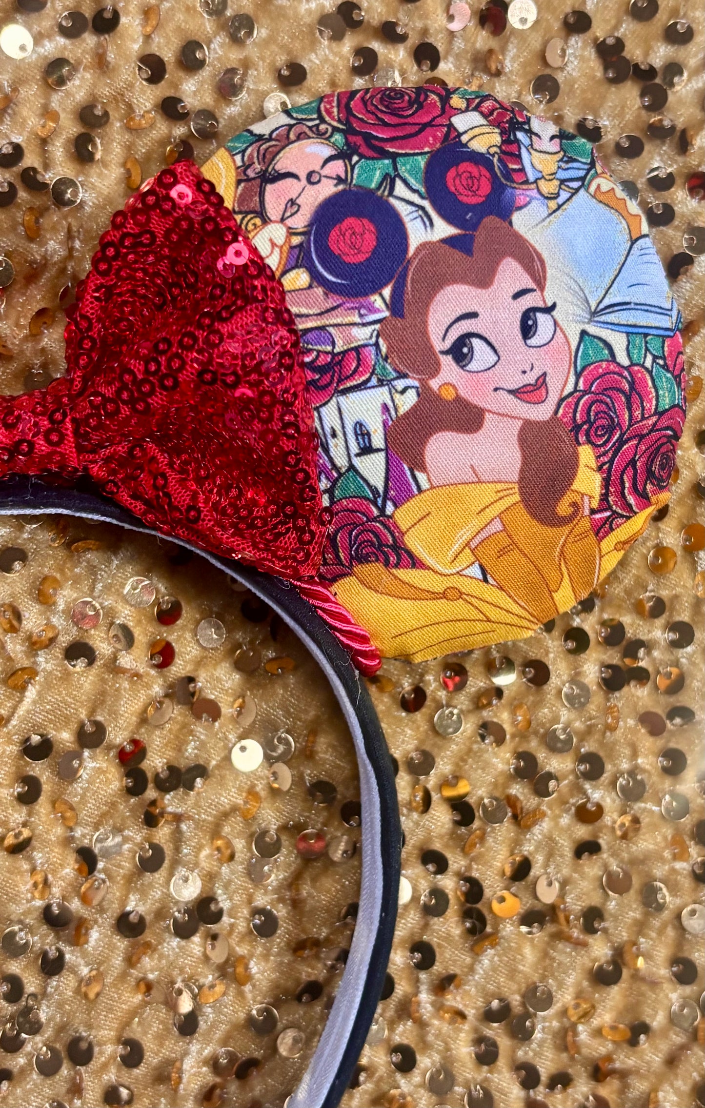Disney Belle mouse ear headband on a glittery background
