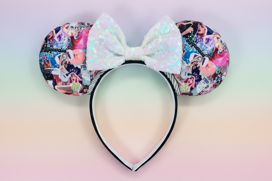 Colorful swiftie collage fabric Minnie Mouse ears with a white sequin bow and silver twisted trim. Shown on a gradient background