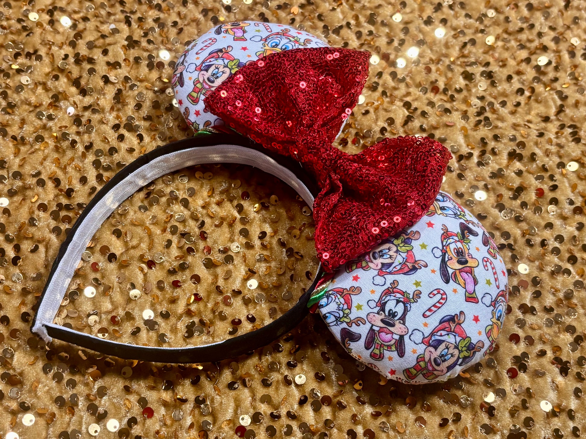Handmade and ready to ship mouse ears. Mouse ears are on a universal sized poly cotton headband and set comes with a red sequin bow. Other colors are available if you leave a note.