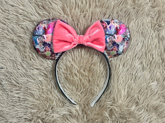 A custom ear headband featuring a large pink velvet bow in the center and patterned ears with a collage of photos, displayed on a beige faux fur background.