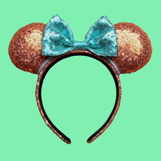 For the Showgirls! Orange Sequin Mouse ears with orange sequin fabric is on the front and back along with on the headband as well that is UNIVERSAL sized with a mint green bow.