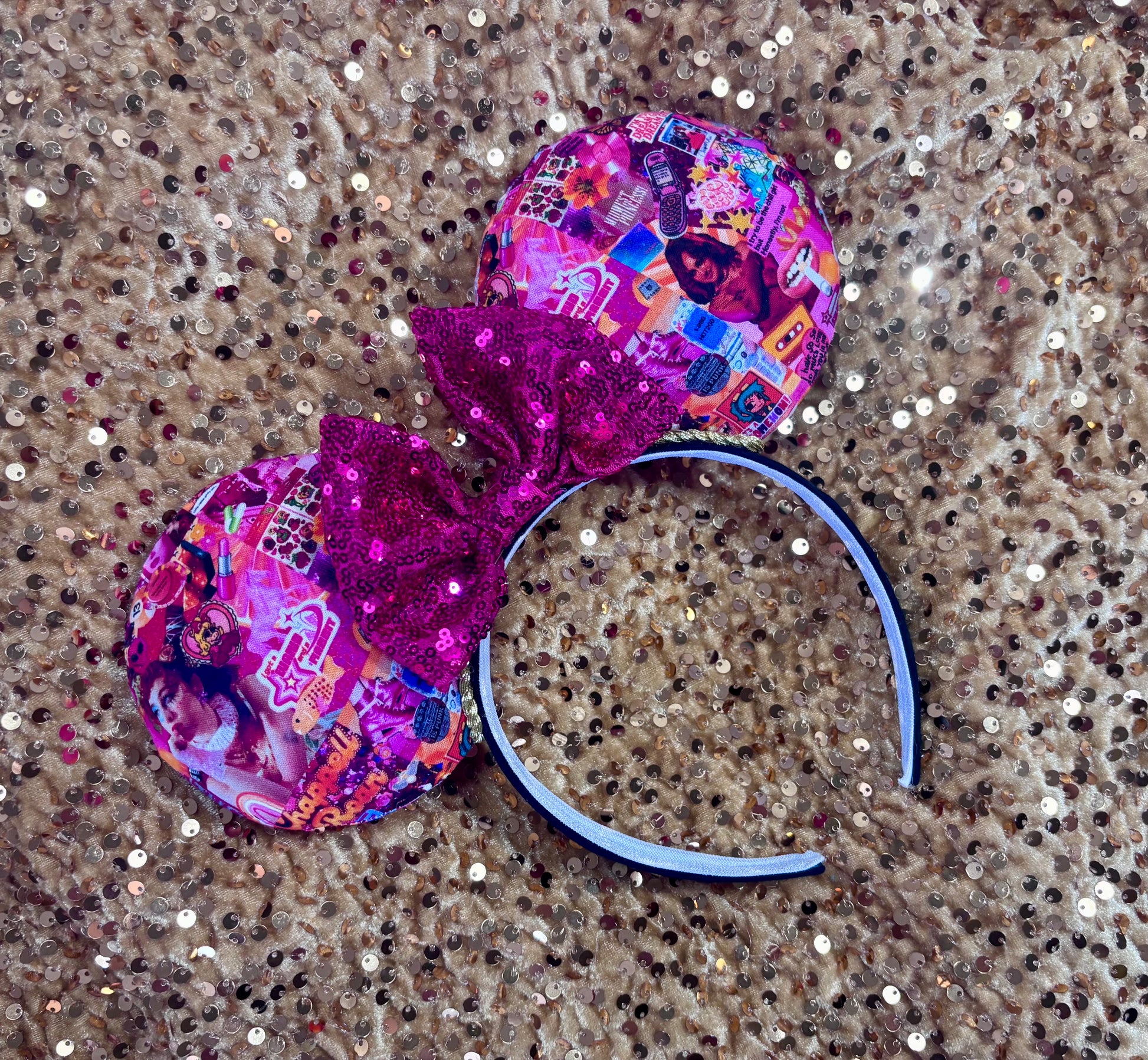 Handmade and ready to ship Colorful Chappell inspired Mouse ears with a hot pink bow on a headband against a gold sequin background.