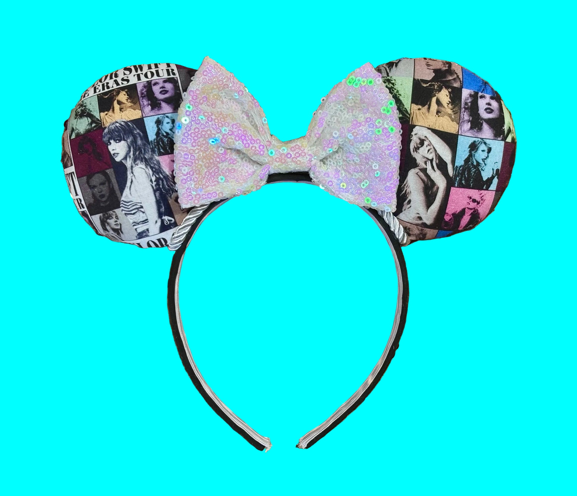 Eras Mashup Mouse Ear headband with white iridescent sequin bow. You can request any color sequin bow in your order by leaving a note. Handmade and ready to ship with fabric on both the front and the back of mouse ears. The set has a silver twisted trim along the inner ears. Ears are on a black poly cotton universal sized headband.