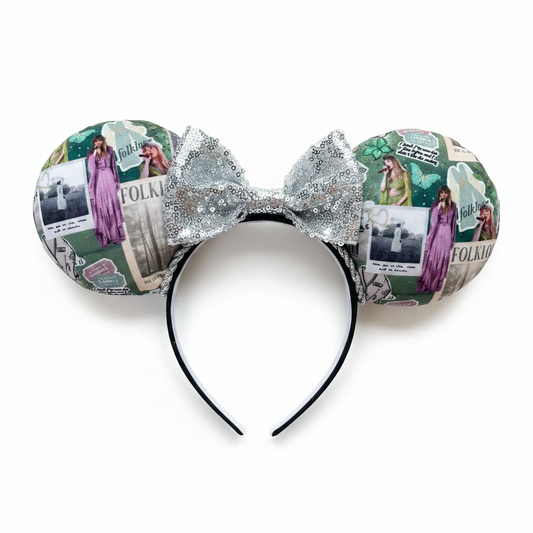 Handmade and ready to ship Folklore Inspired Mouse ears with Tay images from that era on the front and back of mouse ears shown with a silver sequin bow. The headband has a black poly cotton fabric and is a universal sized headband.