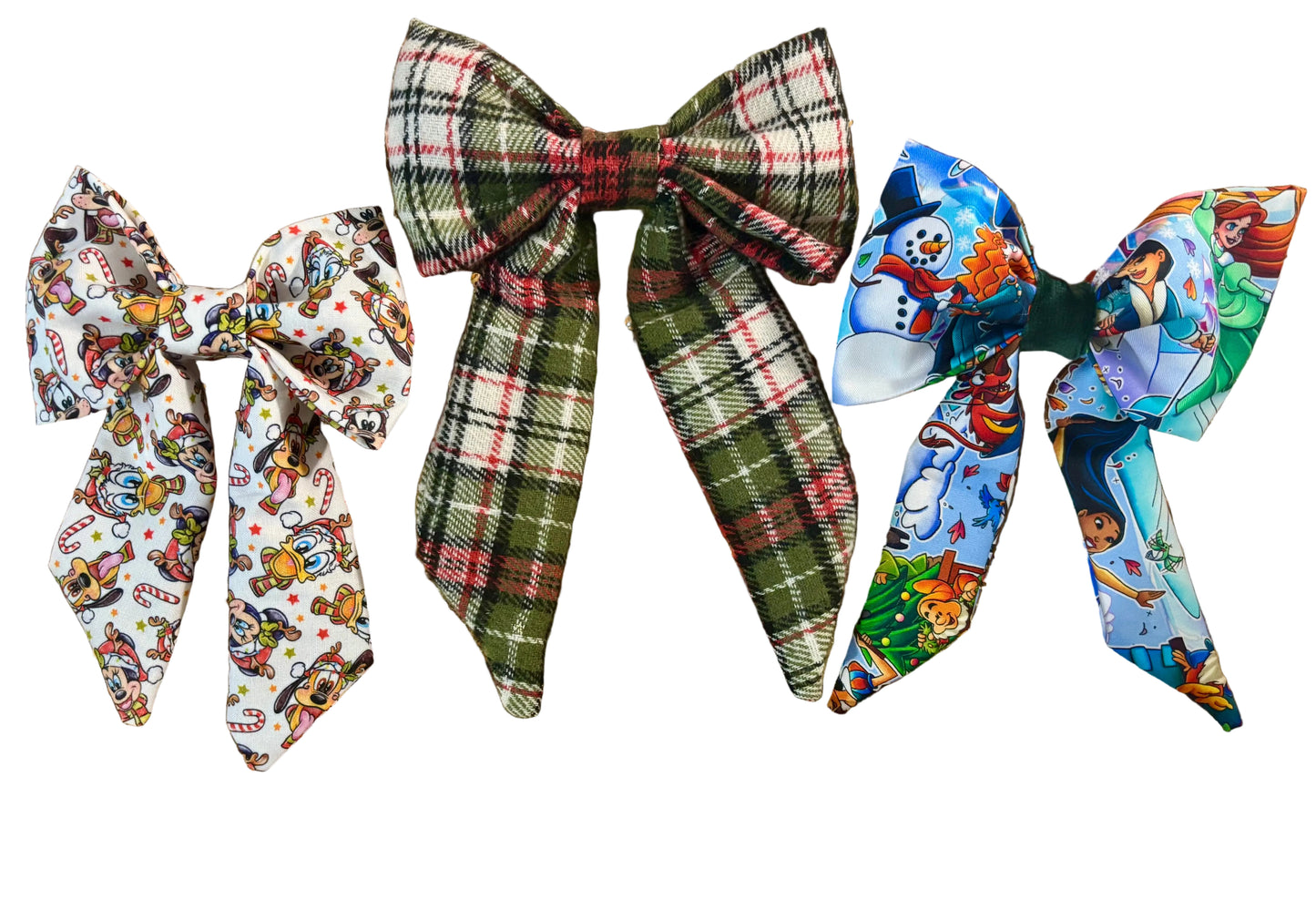 Three colorful hair bows in Christmas Pals, plaid and Snow Friends on a glittery white background