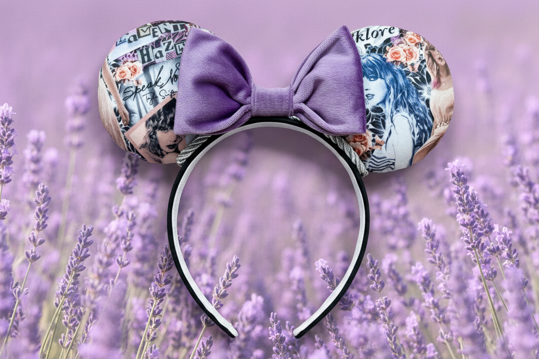 Purple floral mouse ears that are Swiftie inspired on a black headband with soft lavender colored bow. Shown on a lavender background