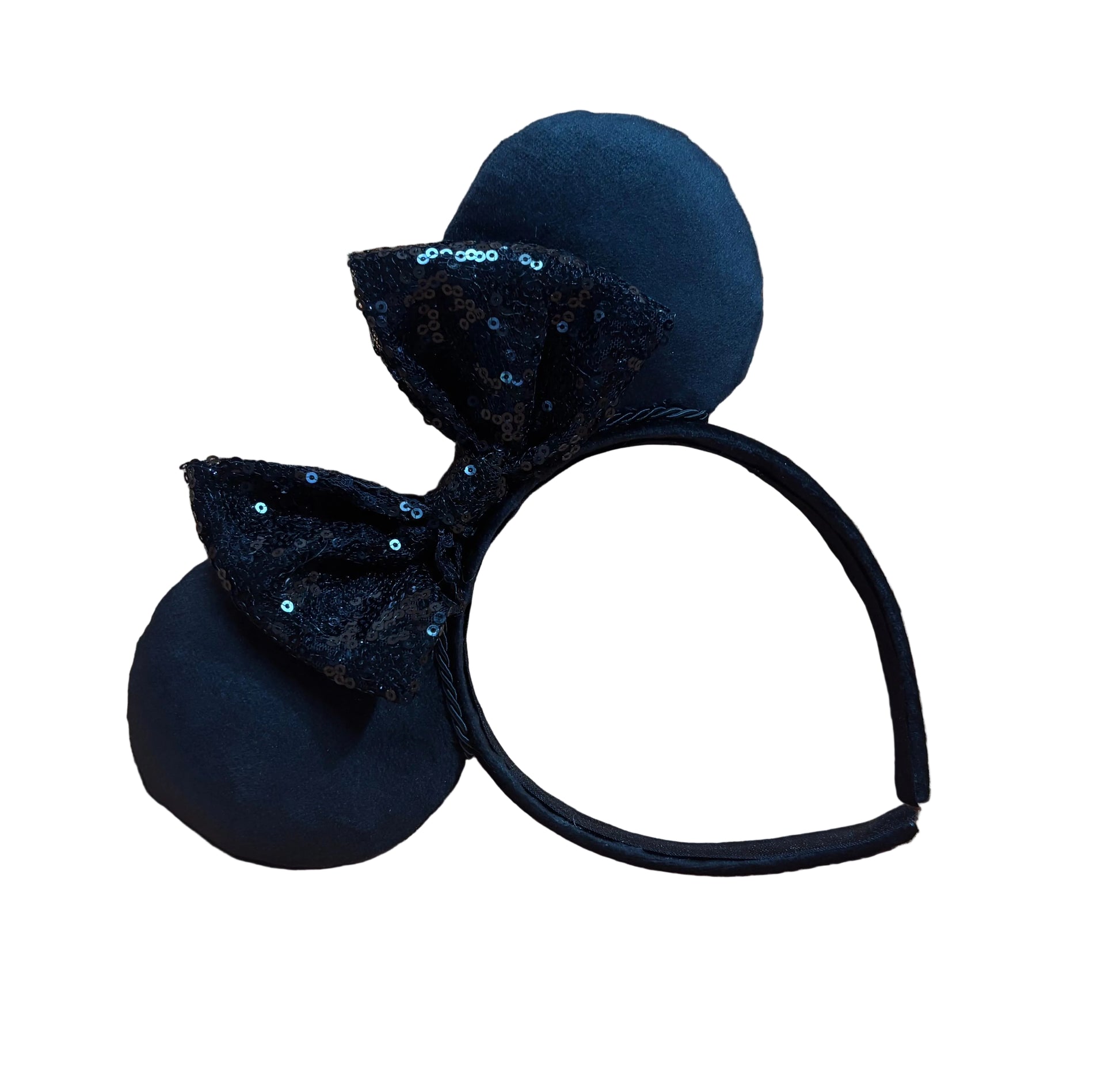 Black headband with mouse ears and a black sequined bow on a textured background