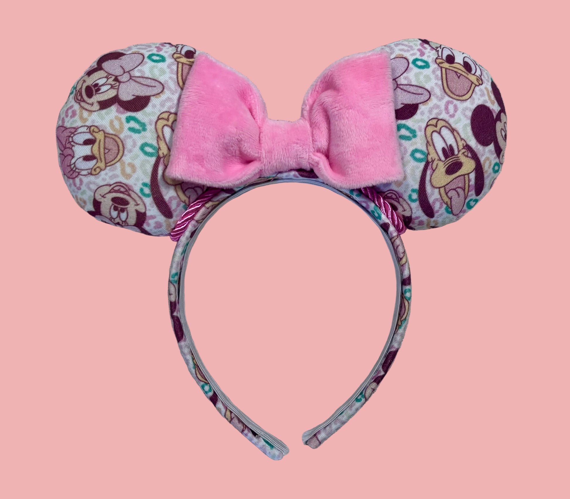 Pink and Leopard print with the fab 5 Mouse ears headband. Handmade and ready to ship Mouse ears with famous Characters on the design and a pink soft bow with pink twisted trim on a universal sized headband.