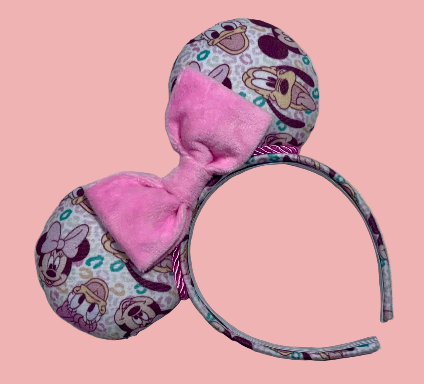 Pink and Leopard print with the fab 5 Mouse ears headband. Handmade and ready to ship Mouse ears with famous Characters on the design and a pink soft bow with pink twisted trim on a universal sized headband.