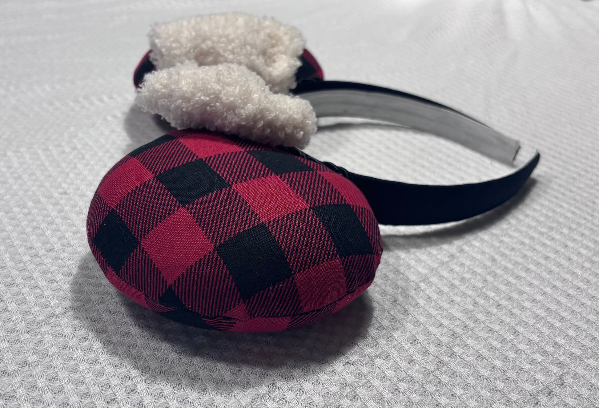 Handmade and ready to ship Buffalo Plaid mouse ears on both the front and back. On a black headband that is universal sized. The set has an off-white soft bow with buffalo plaid middle. Item is shown on a white background.