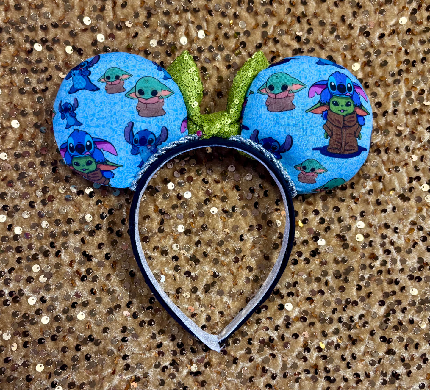 Handmade and ready to ship small friend aka Stitch and Baby Yoda Mouse ears with a lime green sequin bow. Of course, you can request any bow in sequin if you prefer and I will attach it. Shown on a white background.