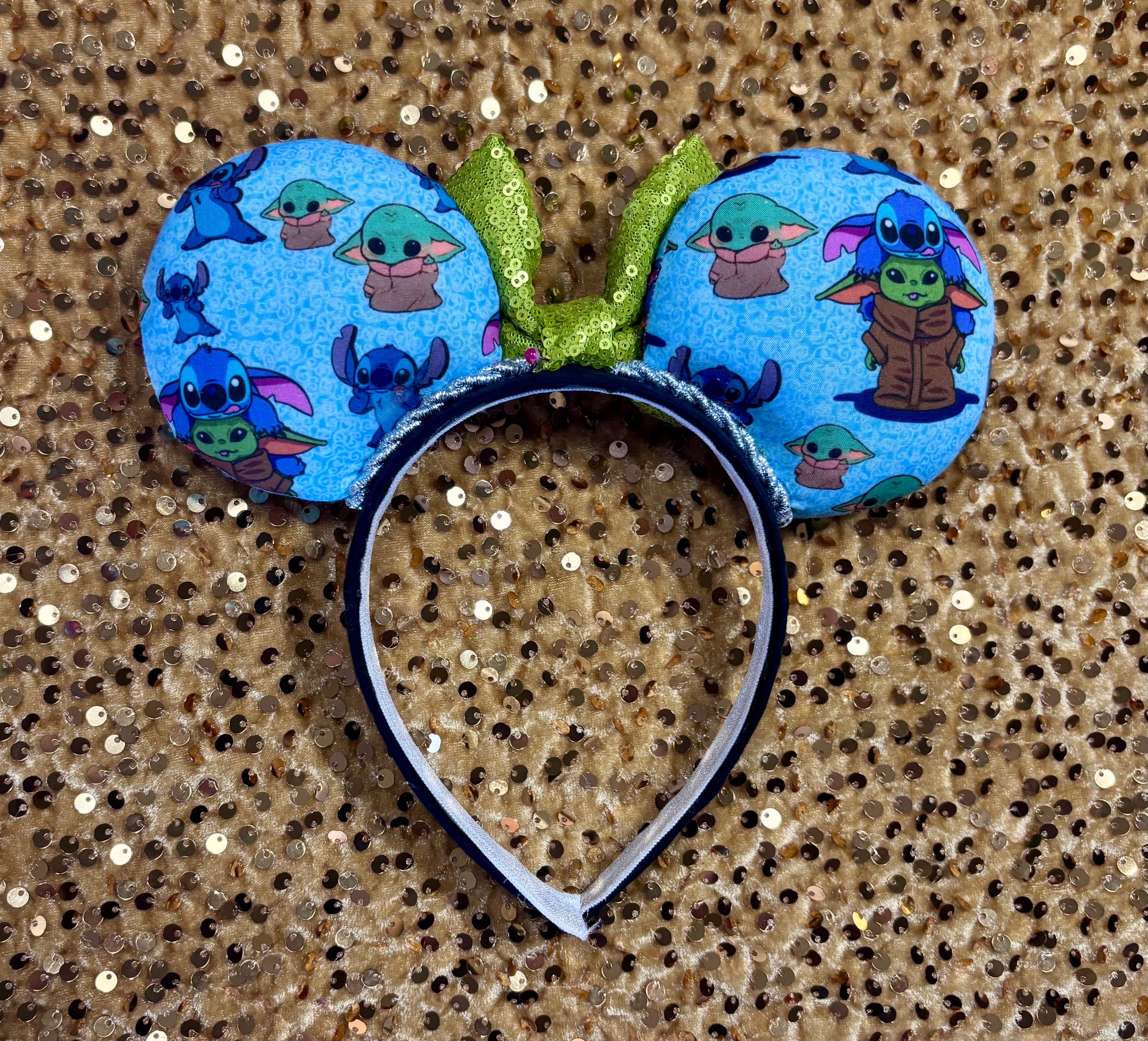 Handmade and ready to ship small friend aka Stitch and Baby Yoda Mouse ears with a lime green sequin bow. Of course, you can request any bow in sequin if you prefer and I will attach it. Shown on a white background.