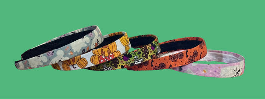In this bundle, you'll receive 5 headbands total. All are on universal headbands and fit most. The sets include mouse ghosts, mouse pumpkins, mouse treats, boo to you and pink ghosts. All handmade and ready to ship. This is a side view of bands and the various designs on them.
