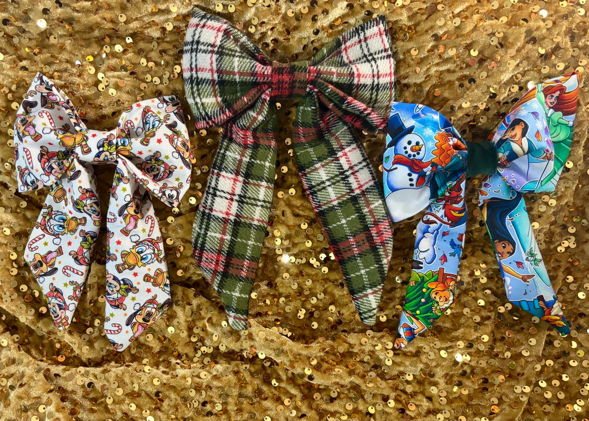 Set of decorative bows on a glittery gold background