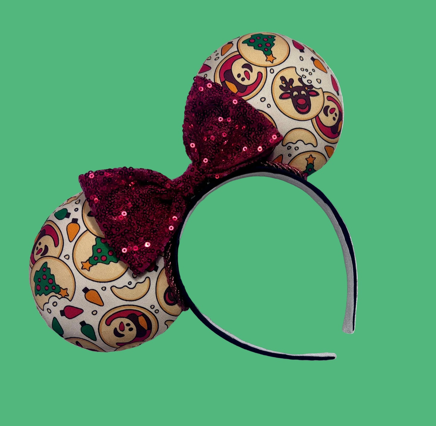 Handmade and ready to ship Christmas Sugar Cookie mouse ears with the fabric on both the front and back. The headband is black universal sized and fits most. The set has a red sequin bow. 