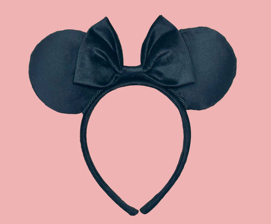 Black velvet mouse ear headband with a large matching velvet bow on a velvet universal sized headband.