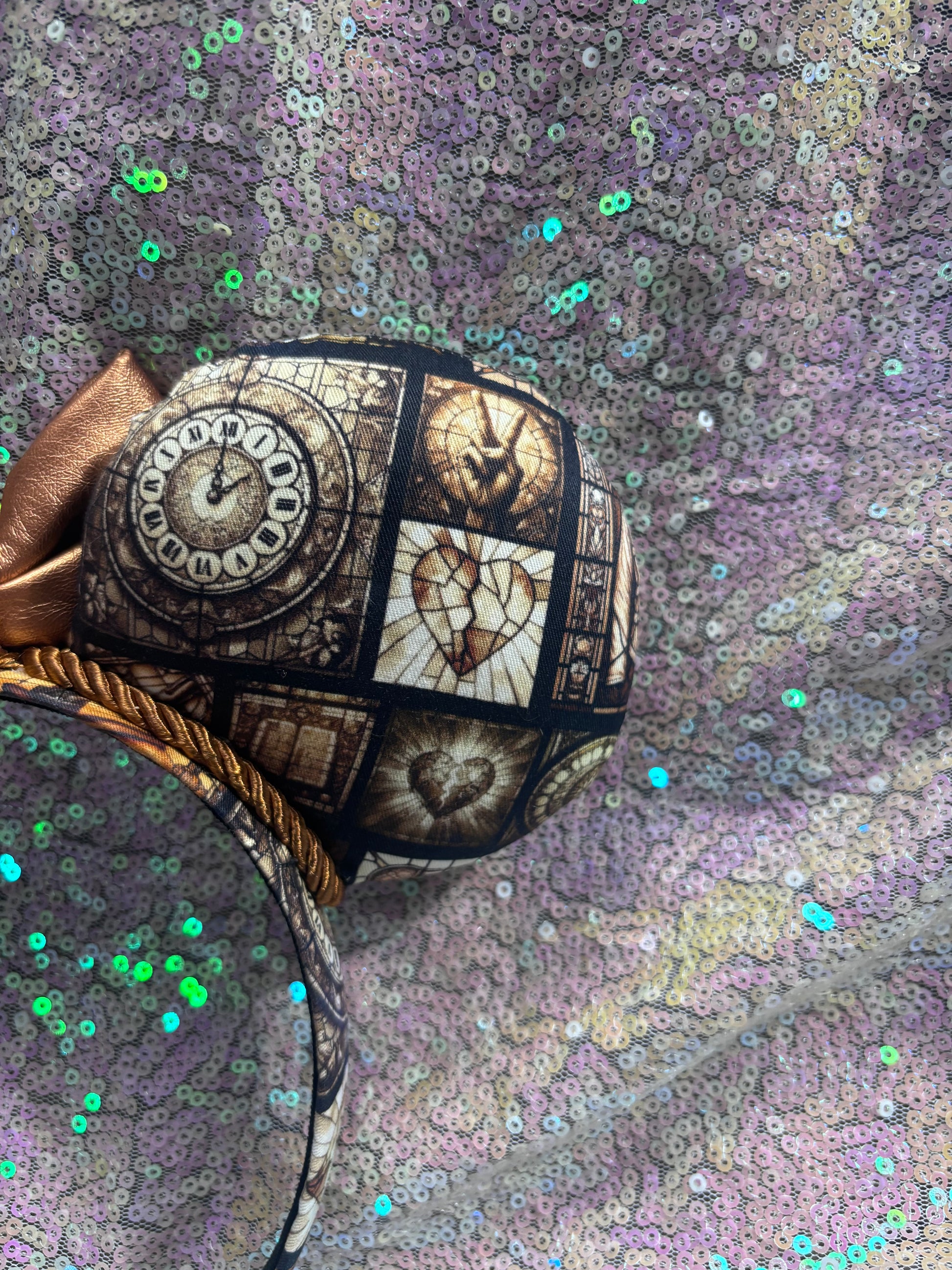 Decorative item with clock design on a textured fabric background