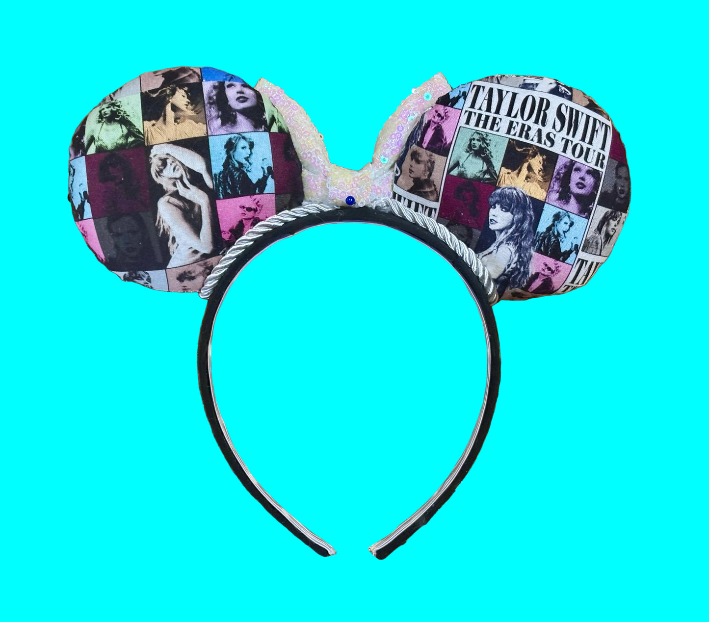 Back view of mouse ears. Eras Mashup Mouse Ear headband with white iridescent sequin bow. You can request any color sequin bow in your order by leaving a note. Handmade and ready to ship with fabric on both the front and the back of mouse ears. The set has a silver twisted trim along the inner ears. Ears are on a black poly cotton universal sized headband.
