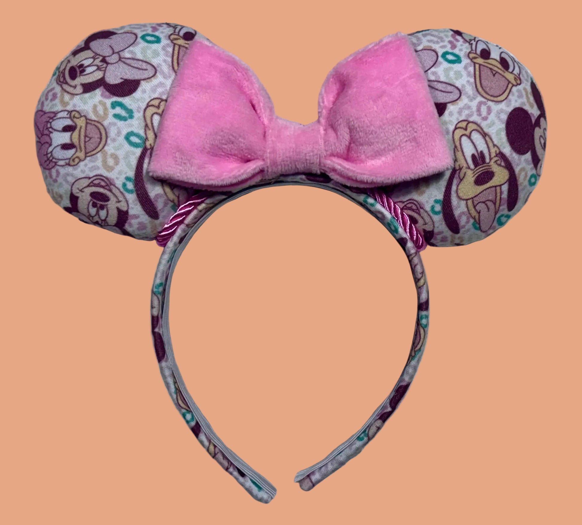 Handmade and ready to ship Leopard Mouse ears headband with a pink plush bow on a universal sized matching headband.