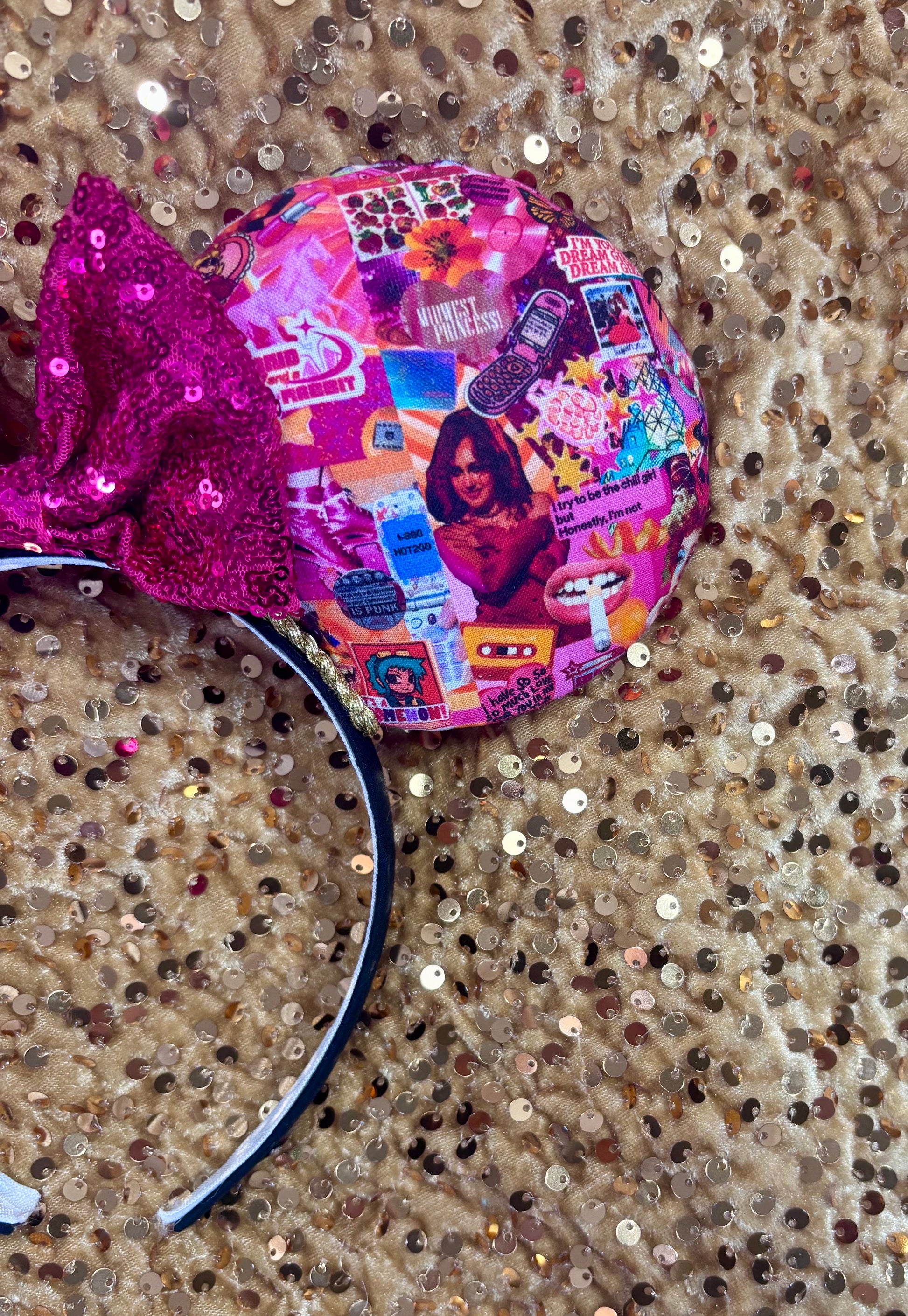 Handmade and ready to ship Colorful Chappell inspired Mouse ears with a hot pink bow on a headband against a gold sequin background.