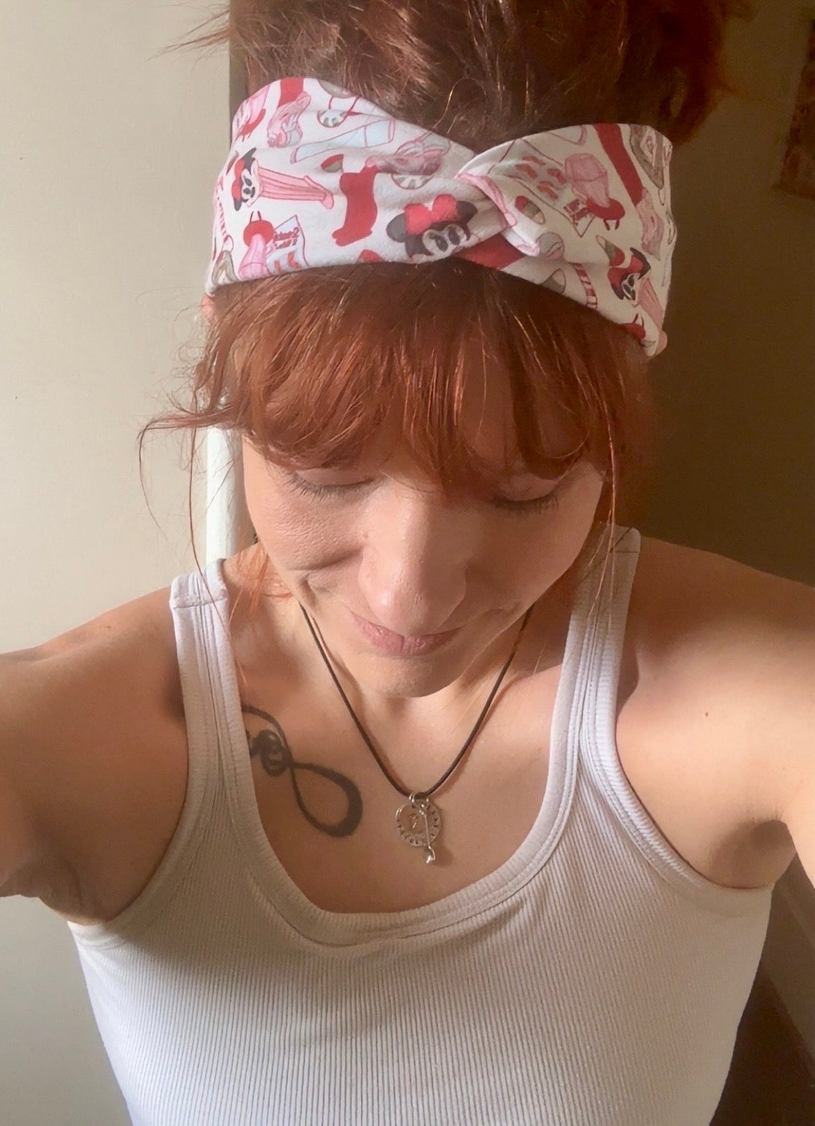 Model Tam wearing her Stocking Stuffers headband wrap. Top view of handmade headwrap. 