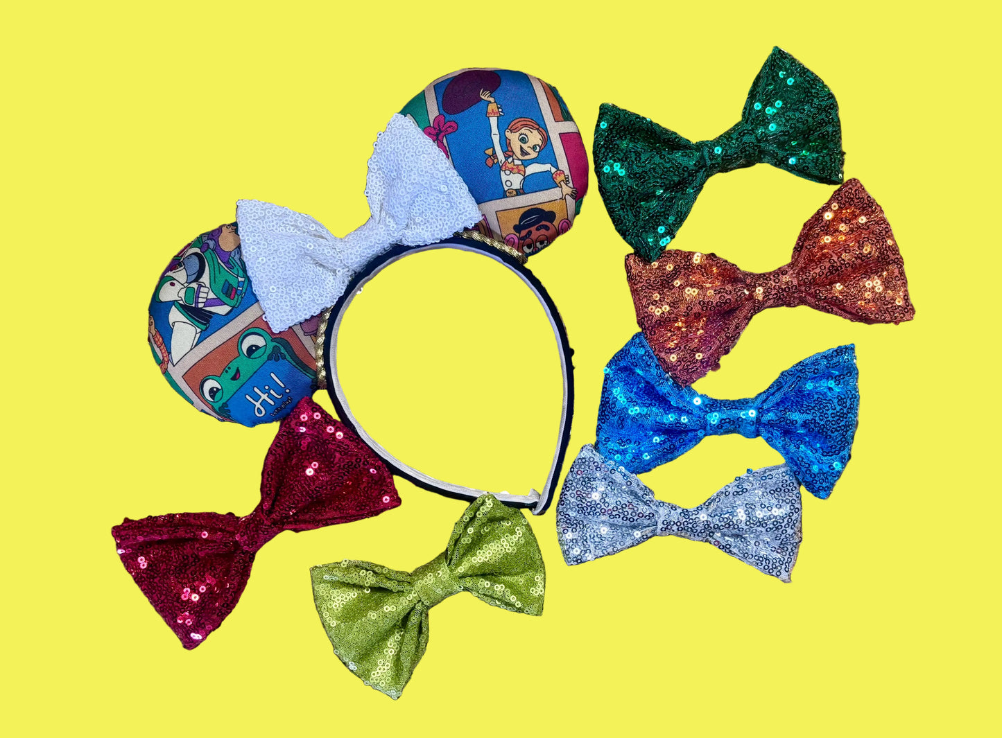 Handmade and ready to ship TS5 Inspired mouse ears. The character fabric is on the front and the back. On a universal sized black poly fabric headband. With a white sequin bow. Shown are many other various bow colors. Just write me a note if you would prefer a different note and I will happily attach the bow color you want.