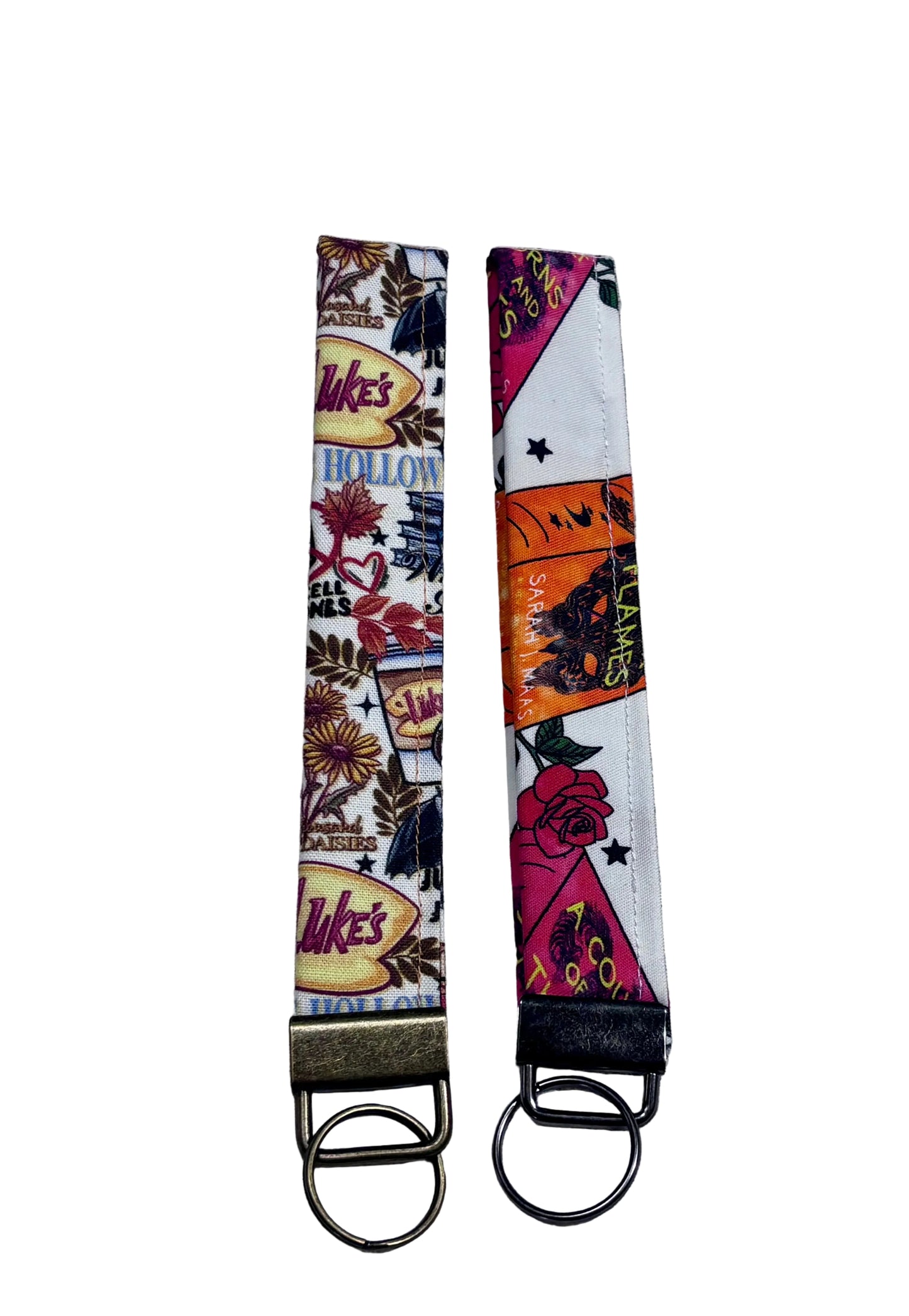 Two colorful keychains with unique designs on a textured gray background