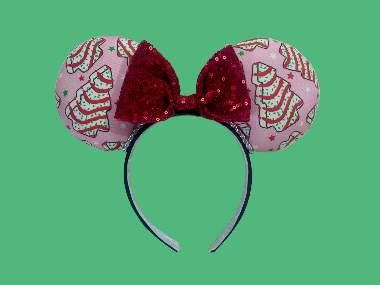 Handmade and ready to ship. Decorative headband with pink fabric and Christmas tree cake inspired fabric on the ears featuring a red sequin bow.