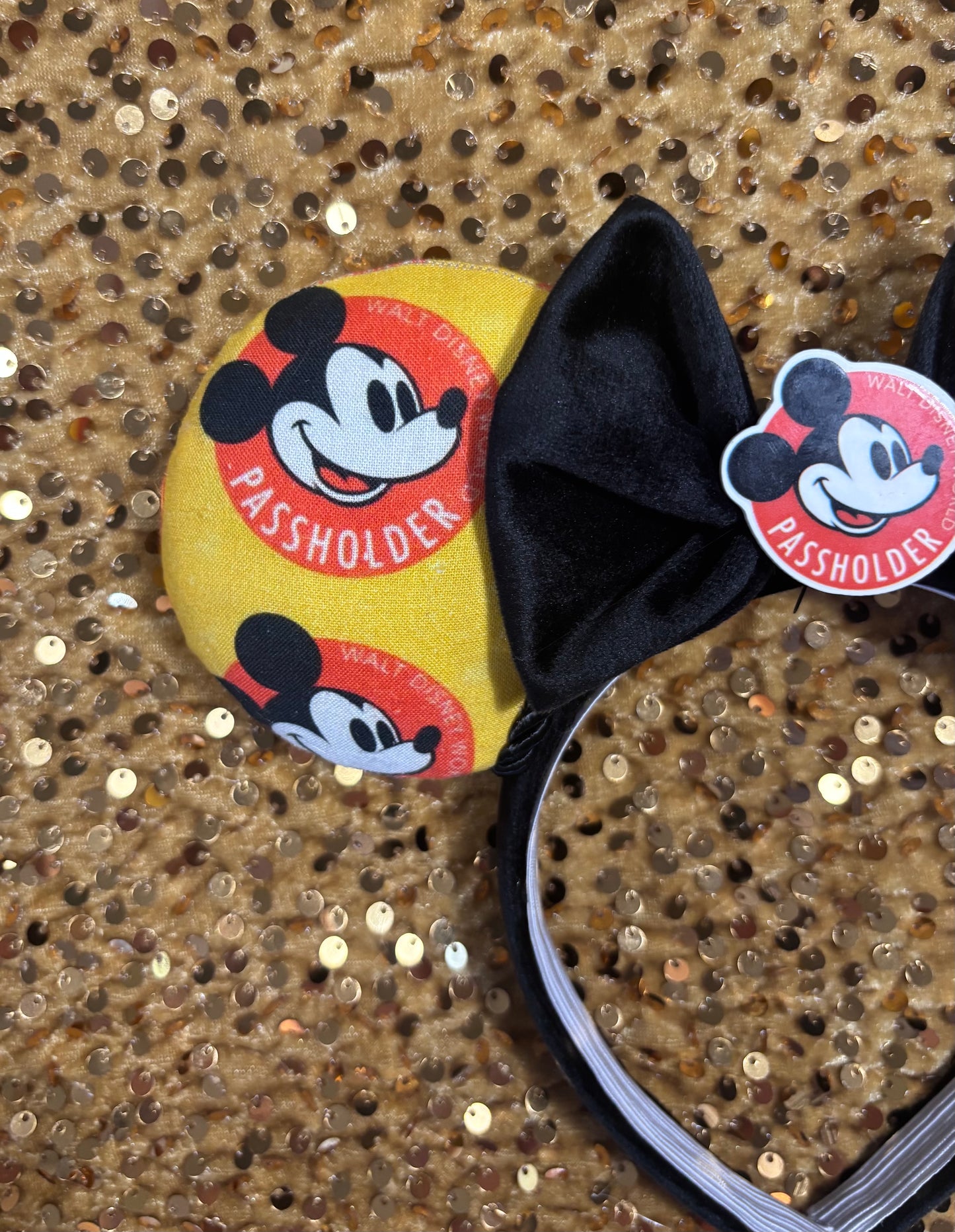 close up of front ear fabric with Passholder Mickey design.
