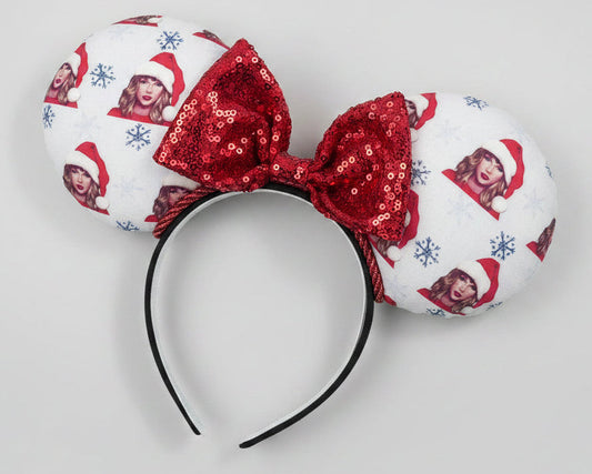 Mouse ear headband with red bow and character print on a white background