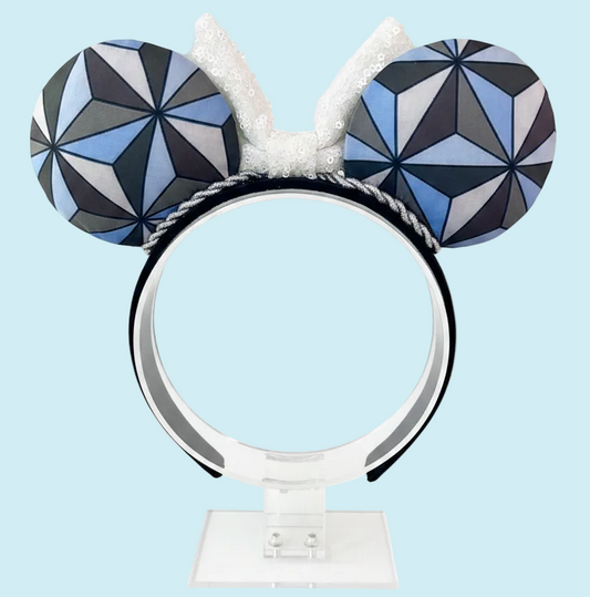 Handmade and ready to ship Mouse ear headband with a geometric design inspired by Spaceship Earth ride and a white iridescent bow on a universal sized black headband.