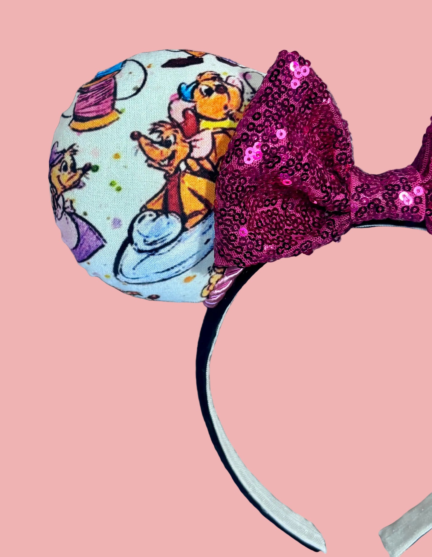 Close up of the front left mouse ear with mice in Cindy's glass slipper. 