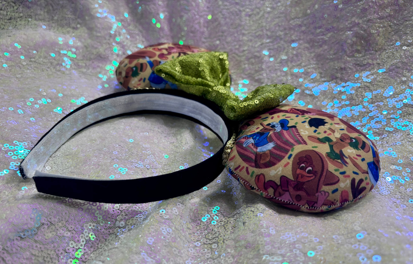 Handmade and ready to ship. These are perfect for Epcot. Three Caballero themed with a lime green sequin bow on a headband making mouse ears. Shown on a white background.