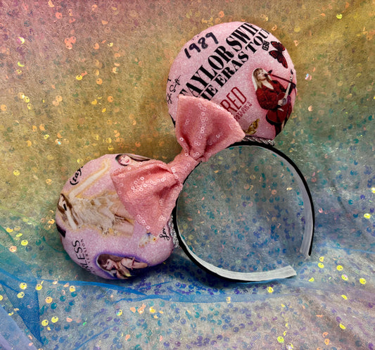 Pink headband with images from the tour with bow and decorative elements on a glittery background