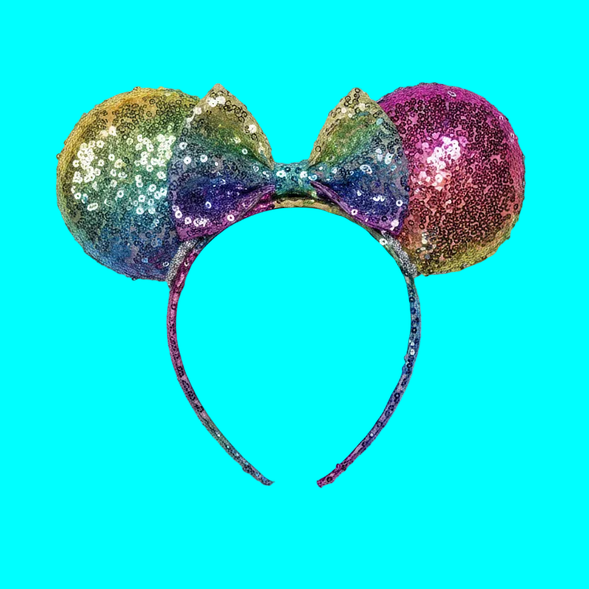 Handmade and ready to ship. Mouse ears with rainbow fabric are on the front and back of mouse ears along with the headband with a matching rainbow sequin bow.