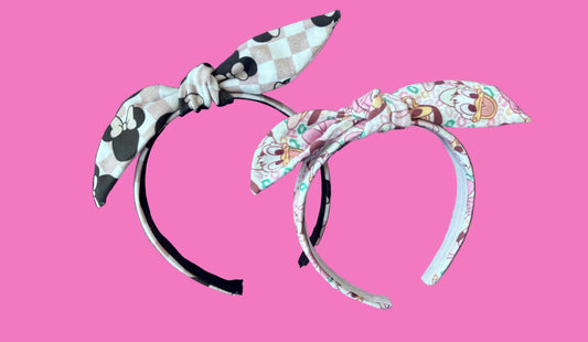 Handmade and ready to ship 2 pack bundle of twisted bow headbands. One in Checkered Minnie and one in Leopard friends. made with stretchy Cotton Lycra fabric and on a universal sized headband lined with elastic.