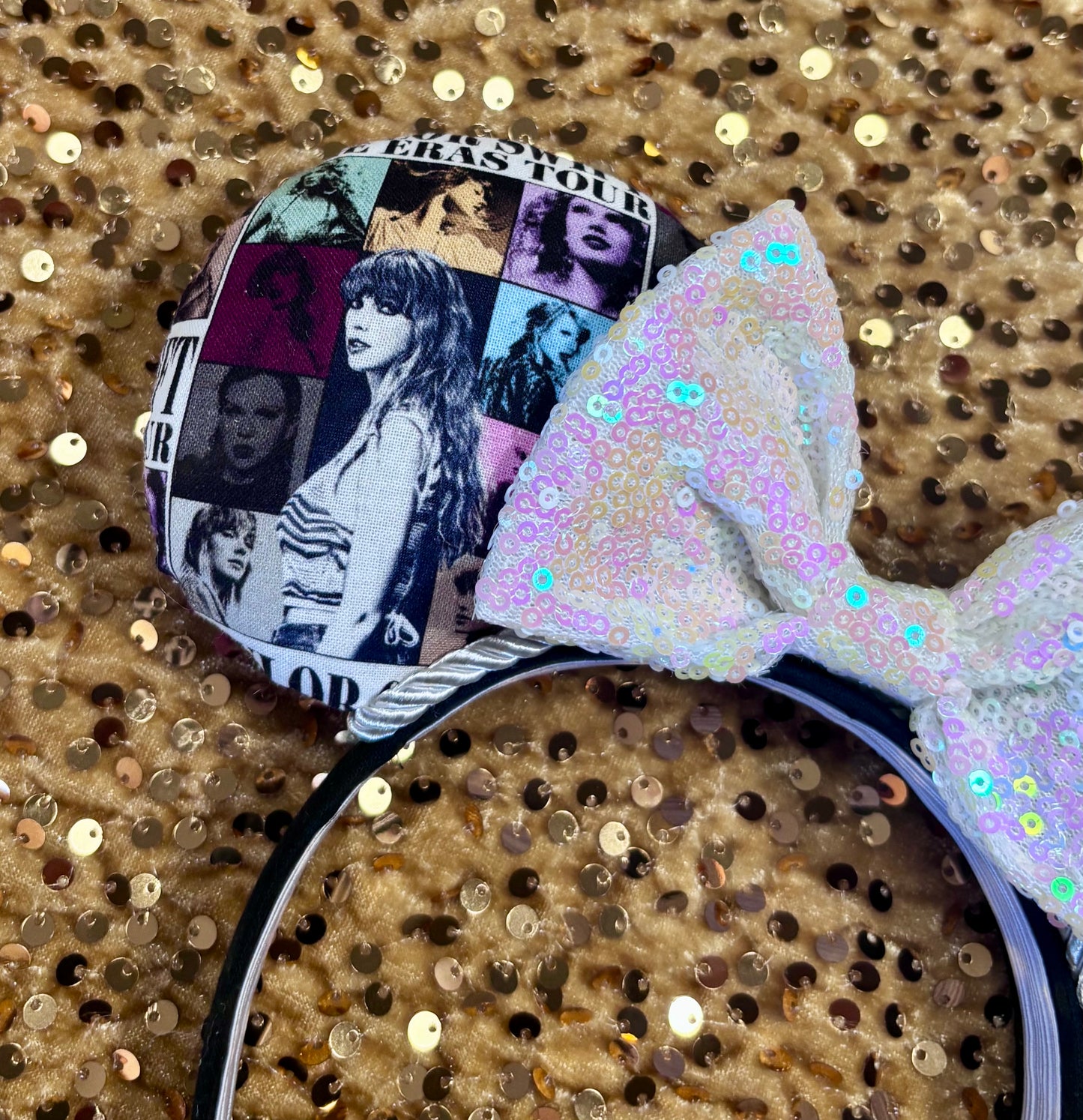 Eras Mashup Mouse Ear headband with white iridescent sequin bow. You can request any color sequin bow in your order by leaving a note. Handmade and ready to ship with fabric on both the front and the back of mouse ears. The set has a silver twisted trim along the inner ears. Ears are on a black poly cotton universal sized headband.