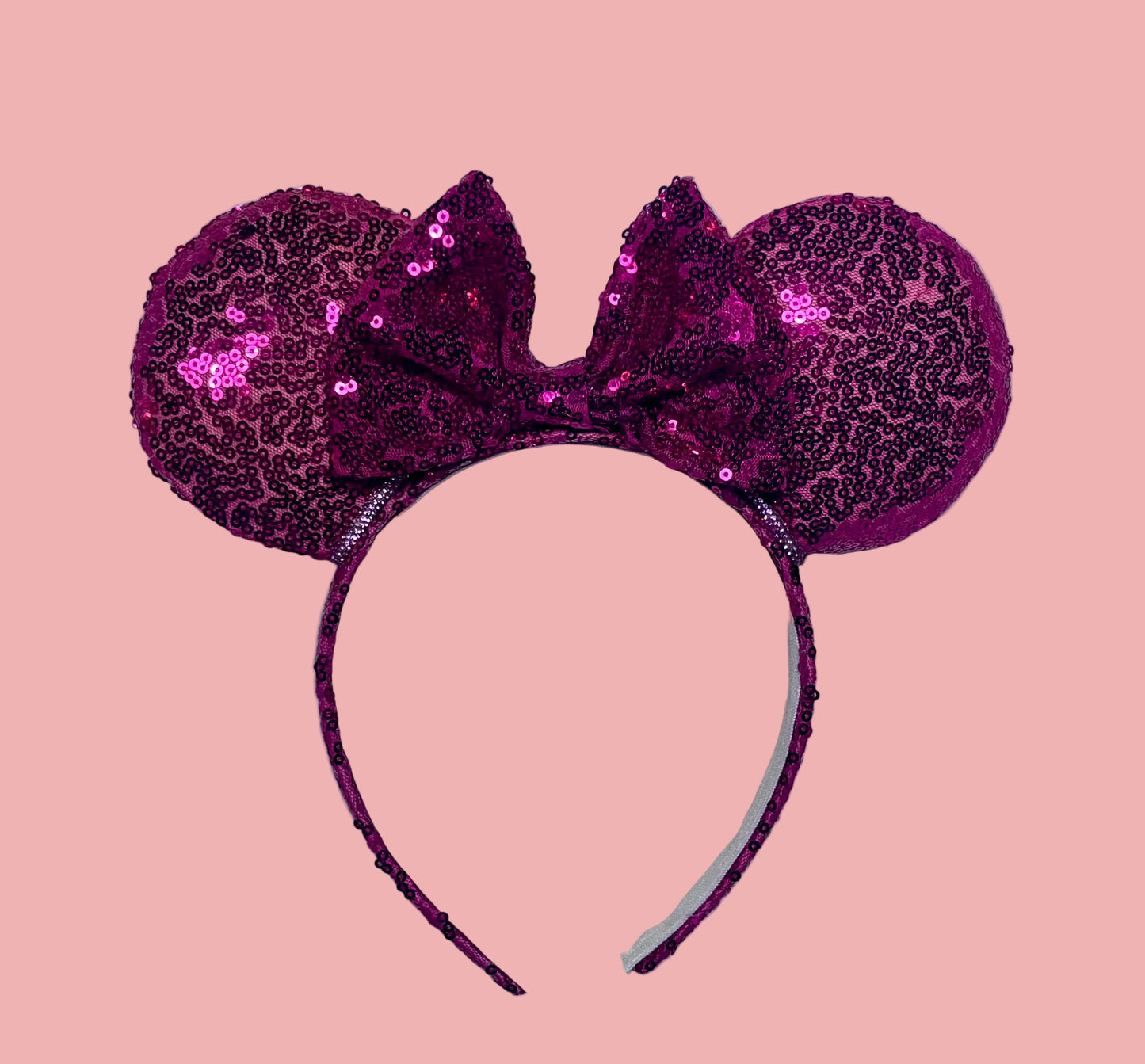 Handmade and ready to ship, Hot Pink Custom Ears. Fabric is on ears front and back with pink rhinestone trim along the inner ears and a matching hot pink sequin bow. The Headband is universal sized and has the same hot pink sequin fabric.