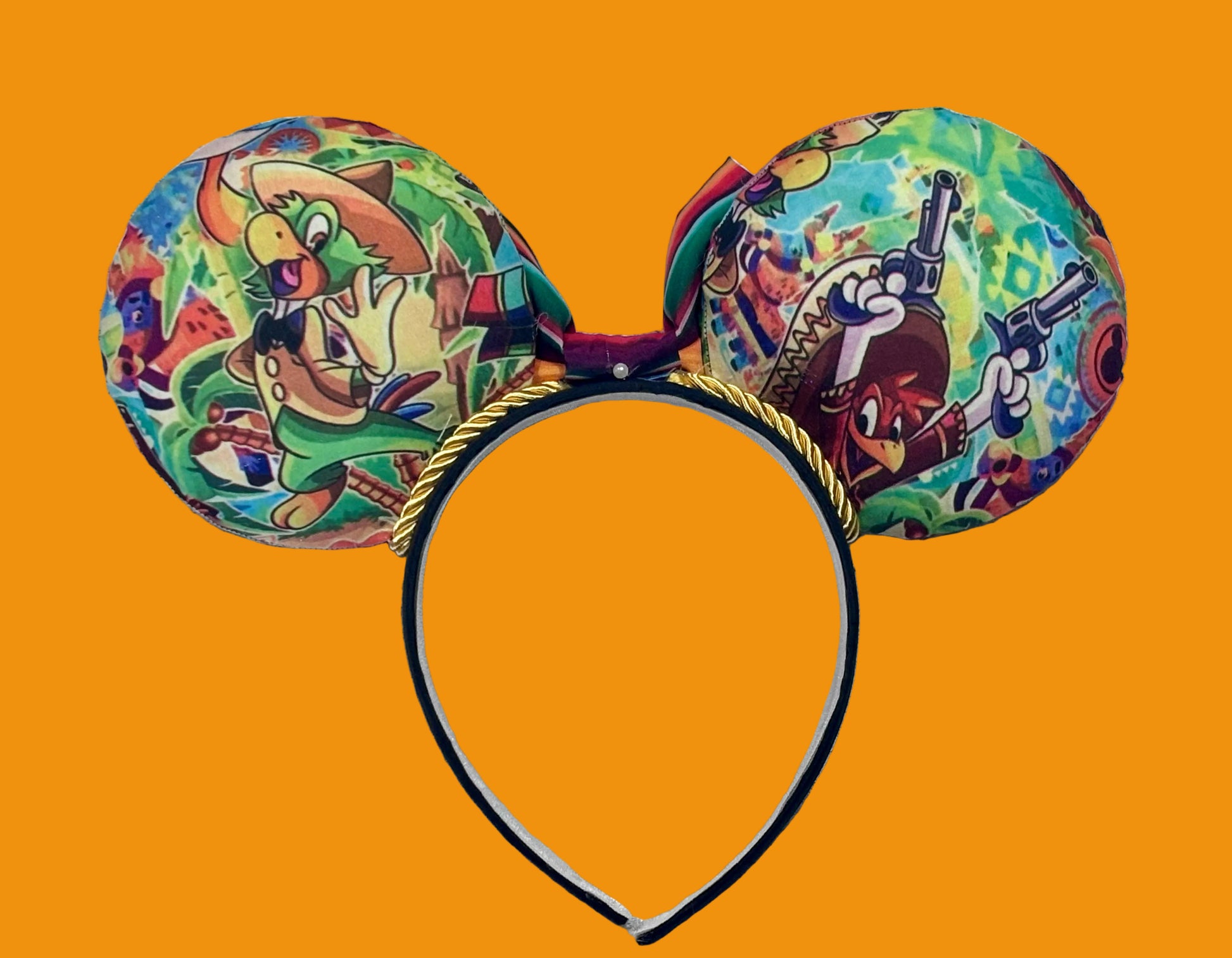 Back view of Mouse ears. Colorful Handmade mouse ears with a colorful bow on an orange background with duck cartoon images on the ears. Handmade and ready to ship. 