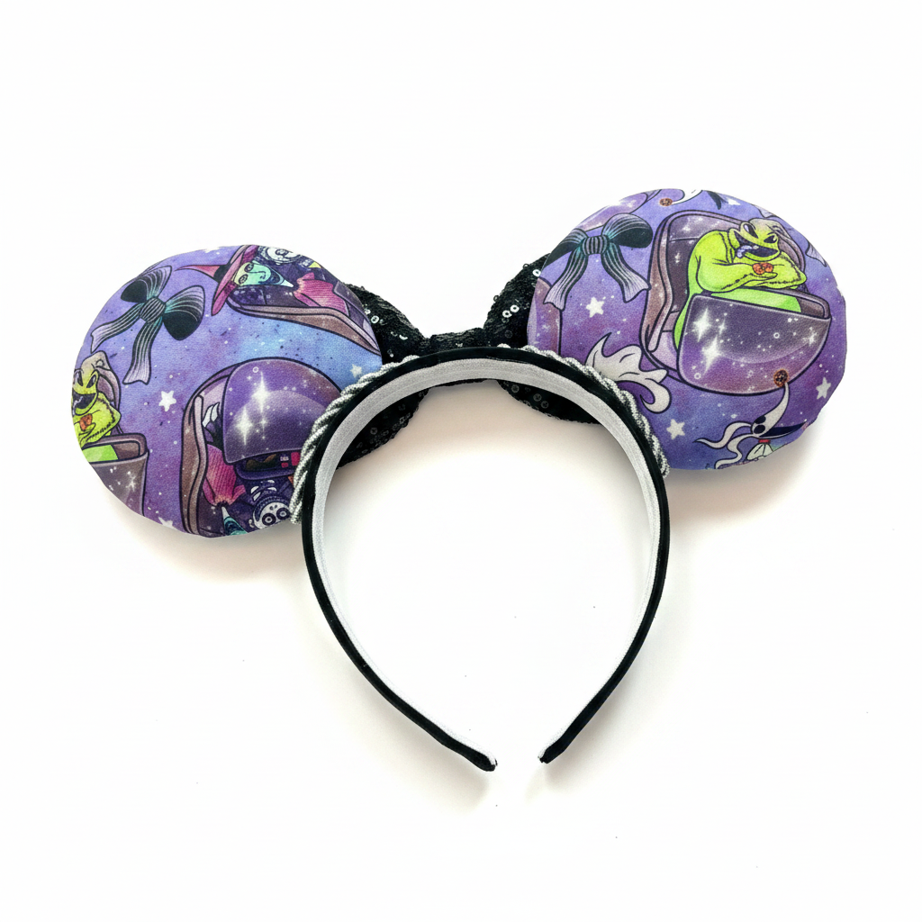 Handmade and ready to ship HM and NBC Mashup mouse ears. The fabric is on both the front and back. The headband is black and lined with white elastic. Shown with a black sequin bow. Item is shown on a white background. Fabric placement varies per set.