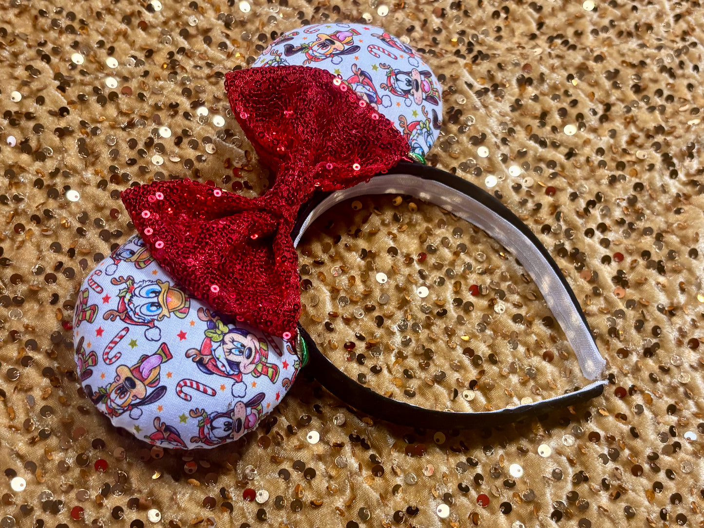 Handmade and ready to ship mouse ears. Mouse ears are on a universal sized poly cotton headband and set comes with a red sequin bow. Other colors are available if you leave a note.