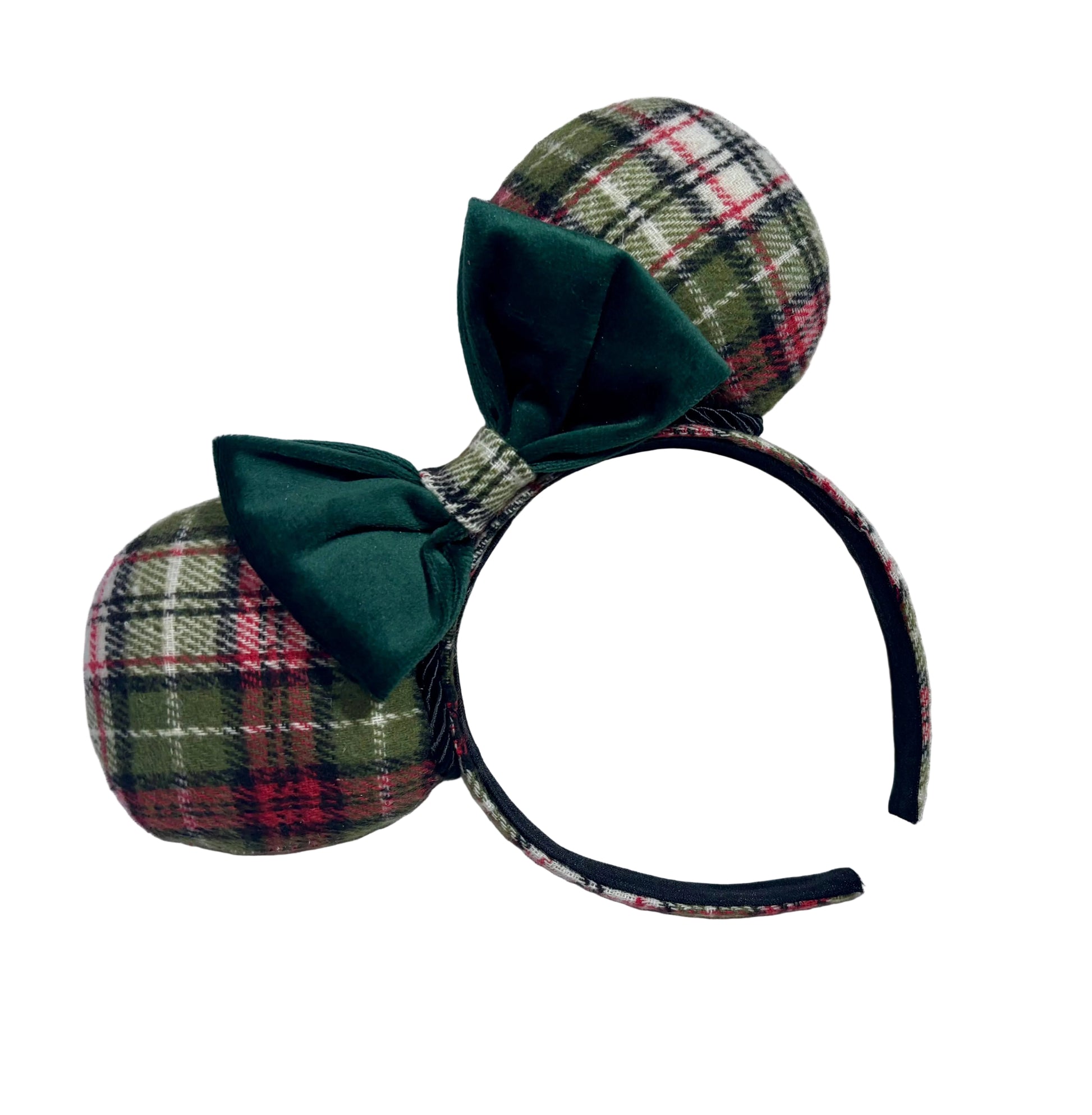 Plaid mouse ears with a green bow on a textured white background