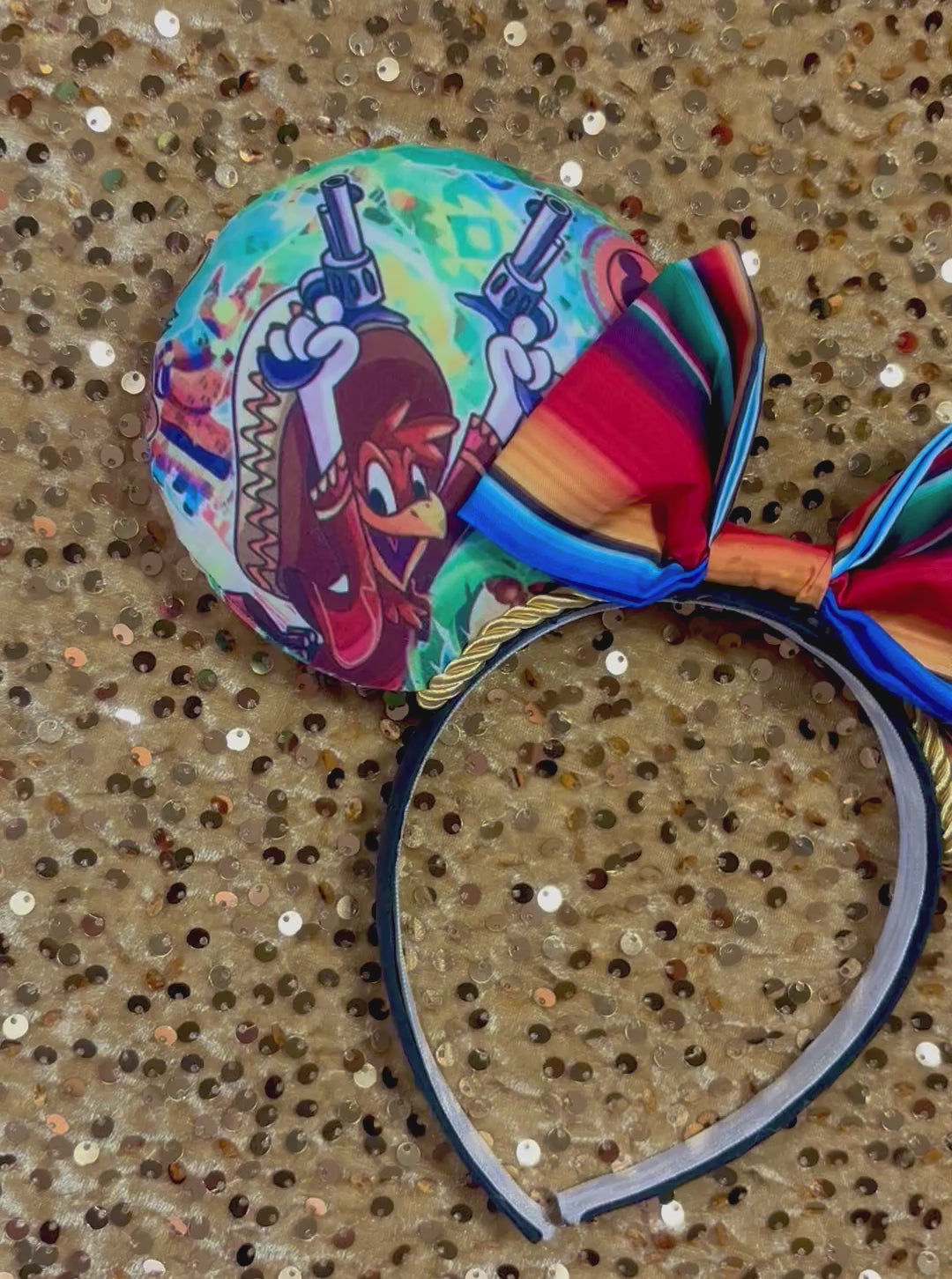 Colorful Handmade and ready to ship mouse ears with a colorful bow on an orange background with duck cartoon images on the ears front and back with Handmade and ready to ship. yellow twisted trim and on a black poly universal sized headband