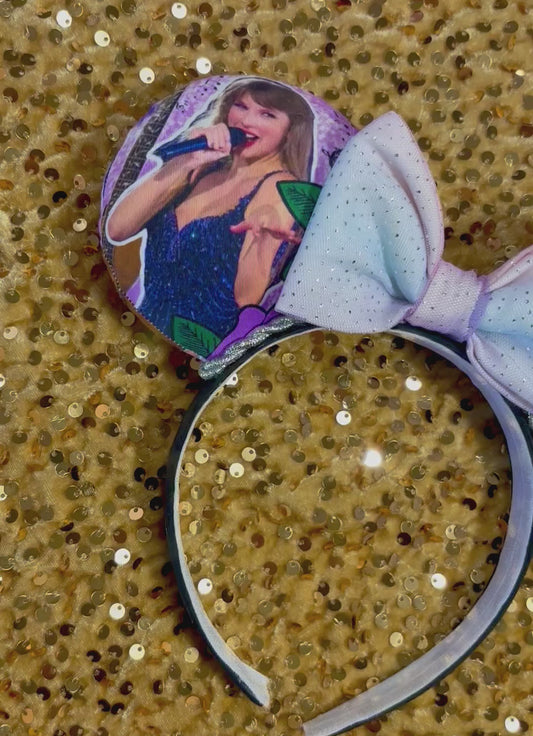 Handmade and ready to ship TS Mouse ears with a new beautiful sewn tulle bow with sparkles on it. Of course, you can still request any bow in sequin if you prefer and I will attach it. Shown on a gold sequin background.